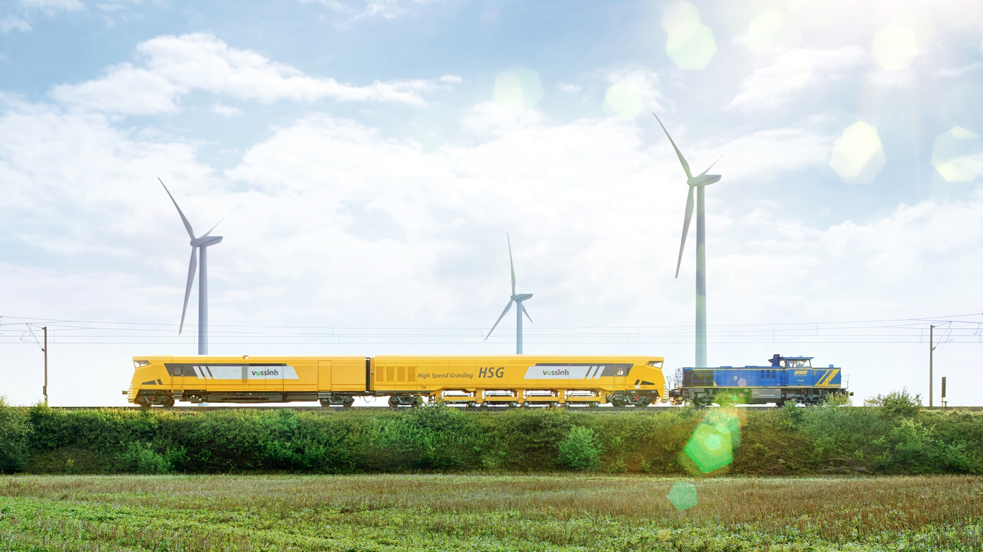 HSG-2 grinding train on rails with blue sky