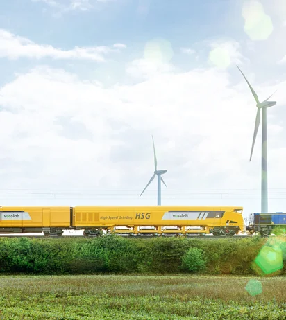 HSG-2 grinding train on rails with blue sky